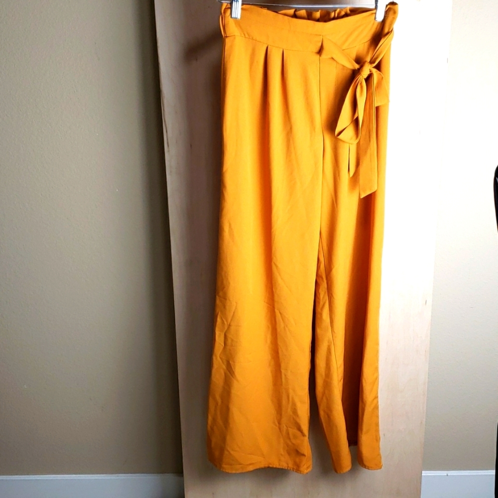 Gold trousers with bow tie